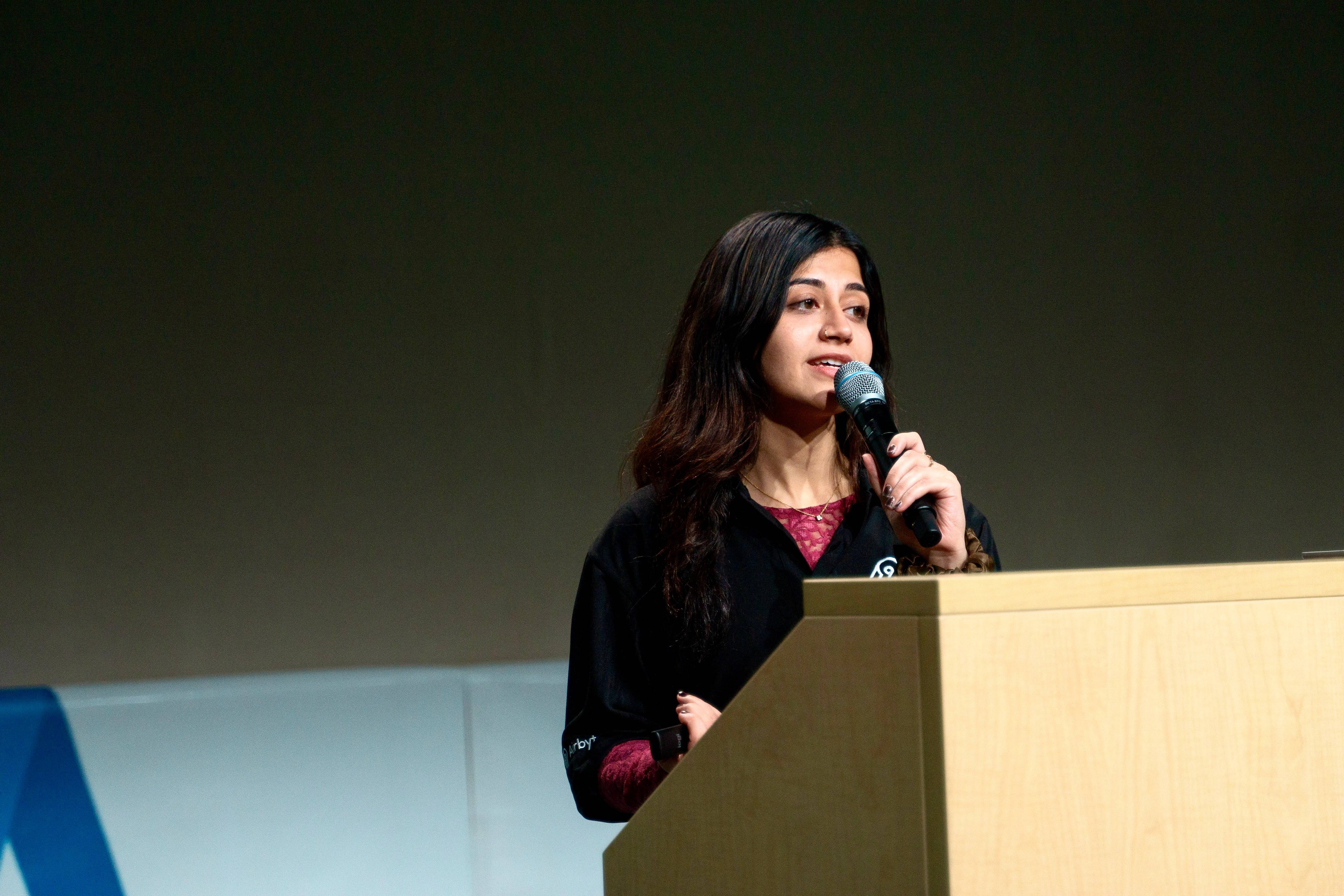 Akriti presenting at an Airbyte event